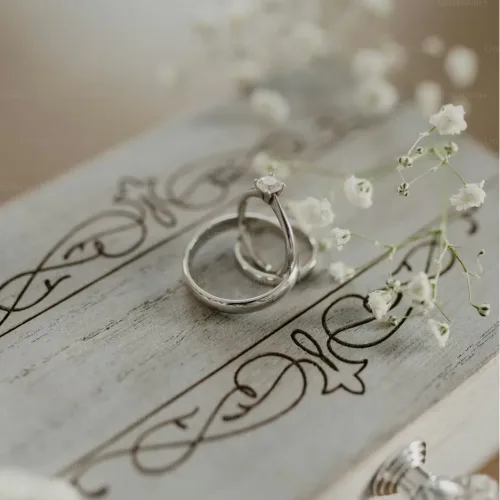 Screenshot 2026-01-08 at 15-13-17 A couple of rings sitting on top of a wooden box photo – Flowers Image on Unsplash